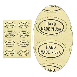 REGULAR STOCK Adhesive label, paper, gold and black, 1/2 x 5/16 inch oval with "HAND MADE IN USA."